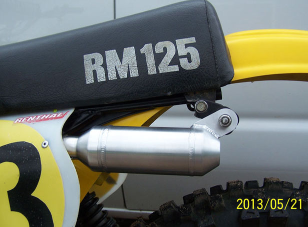 Silencer on bike, view in pits.